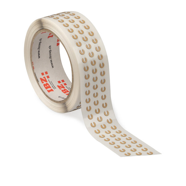 L'illustration montre des pièces étampées autocollantes qui ont été découpées en petites pièces en forme de fer à cheval. Le liner est transparent, l'arrière-plan est blanc. 